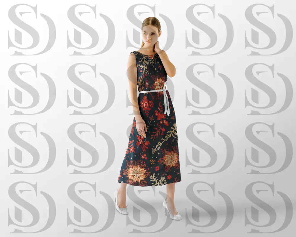 Fashion mockup of a model wearing a long dress printed with a dark blue seamless floral pattern in coral, peach, and beige tones.