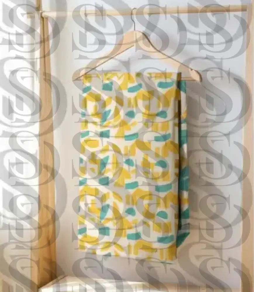 Abstract geometric fabric pattern displayed on hanging textile