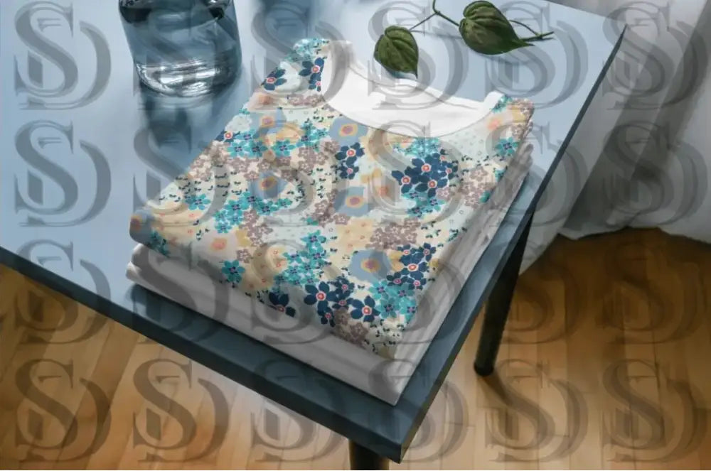 Elegant blue floral pattern displayed on fabric for textile use
