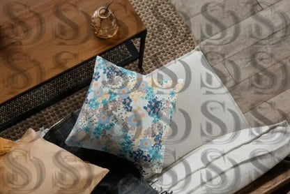 Decorative cushion featuring blooming harmony blue floral design
