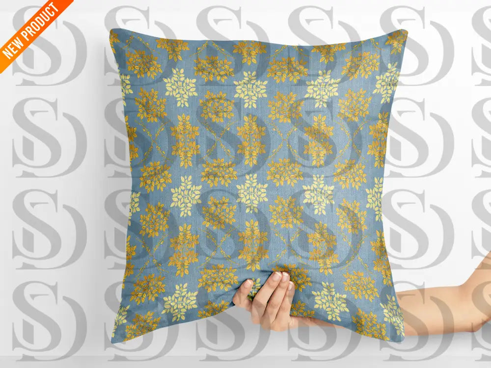 Decorative cushion featuring blue and gold botanical damask seamless pattern