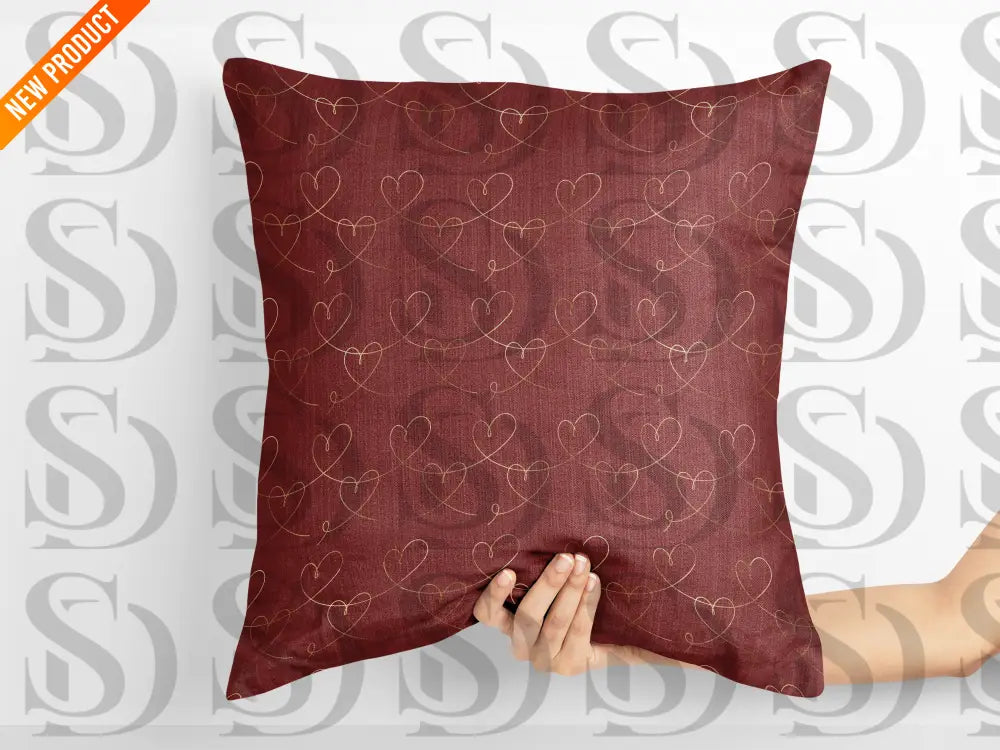 Decorative pillow featuring gold heart line seamless pattern
