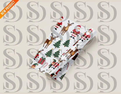 Mockup of rolled wrapping paper displaying the festive Santa and reindeer seamless holiday pattern.