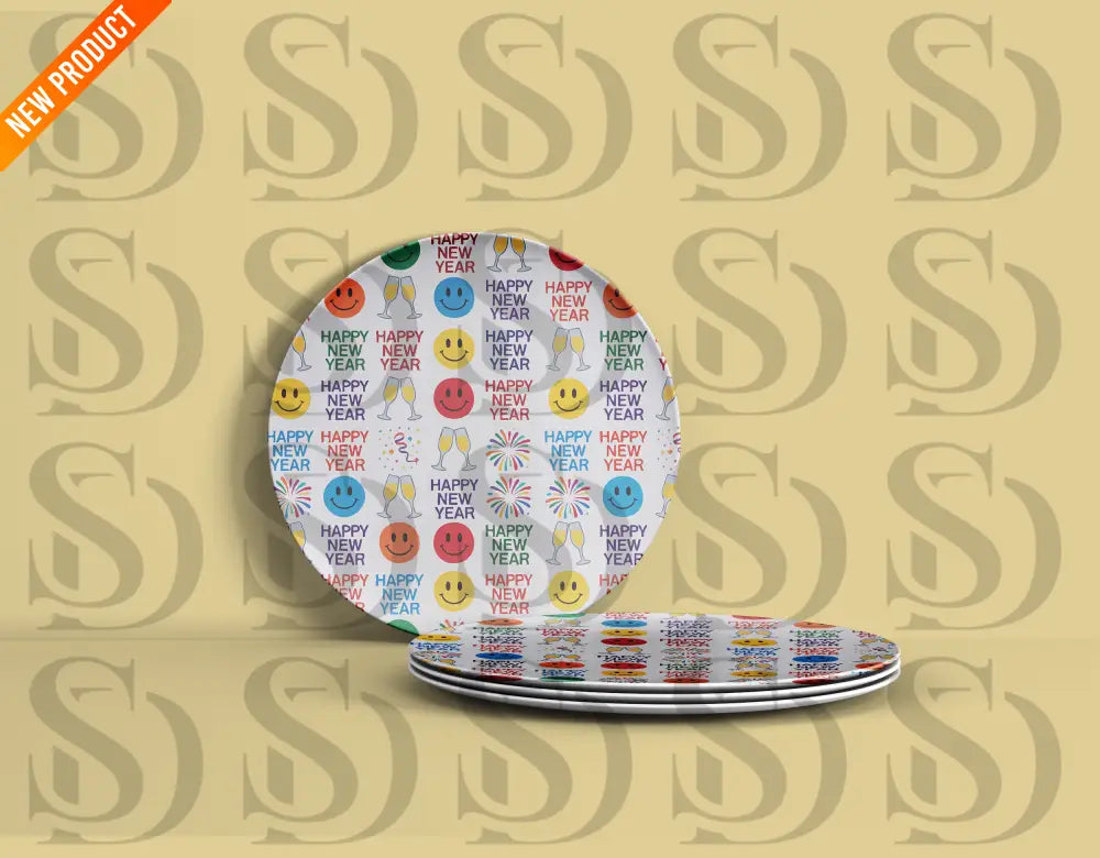 Plates featuring a cheerful New Year design with colorful smiley faces, fireworks, gift boxes, and “Happy New Year” in various colors.