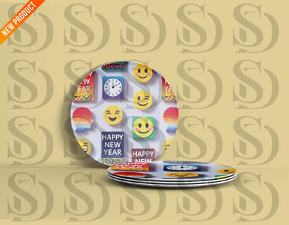 Decorative plates featuring colorful Happy New Year emoji pattern.