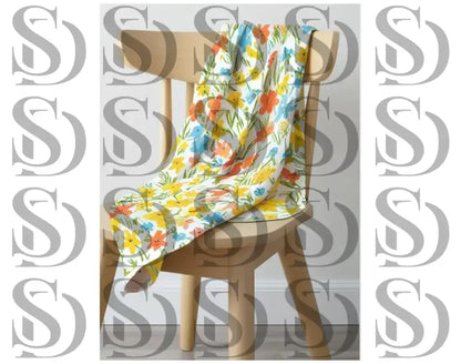 Draped fabric featuring colorful floral seamless pattern on chair
