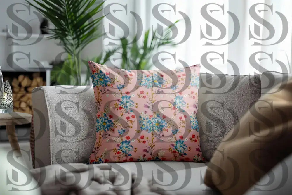 Soft pastel spring floral pattern displayed on a decorative cushion in a modern living room
